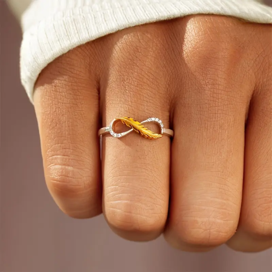 Infinity Feather Ring | Støtt brystkreft